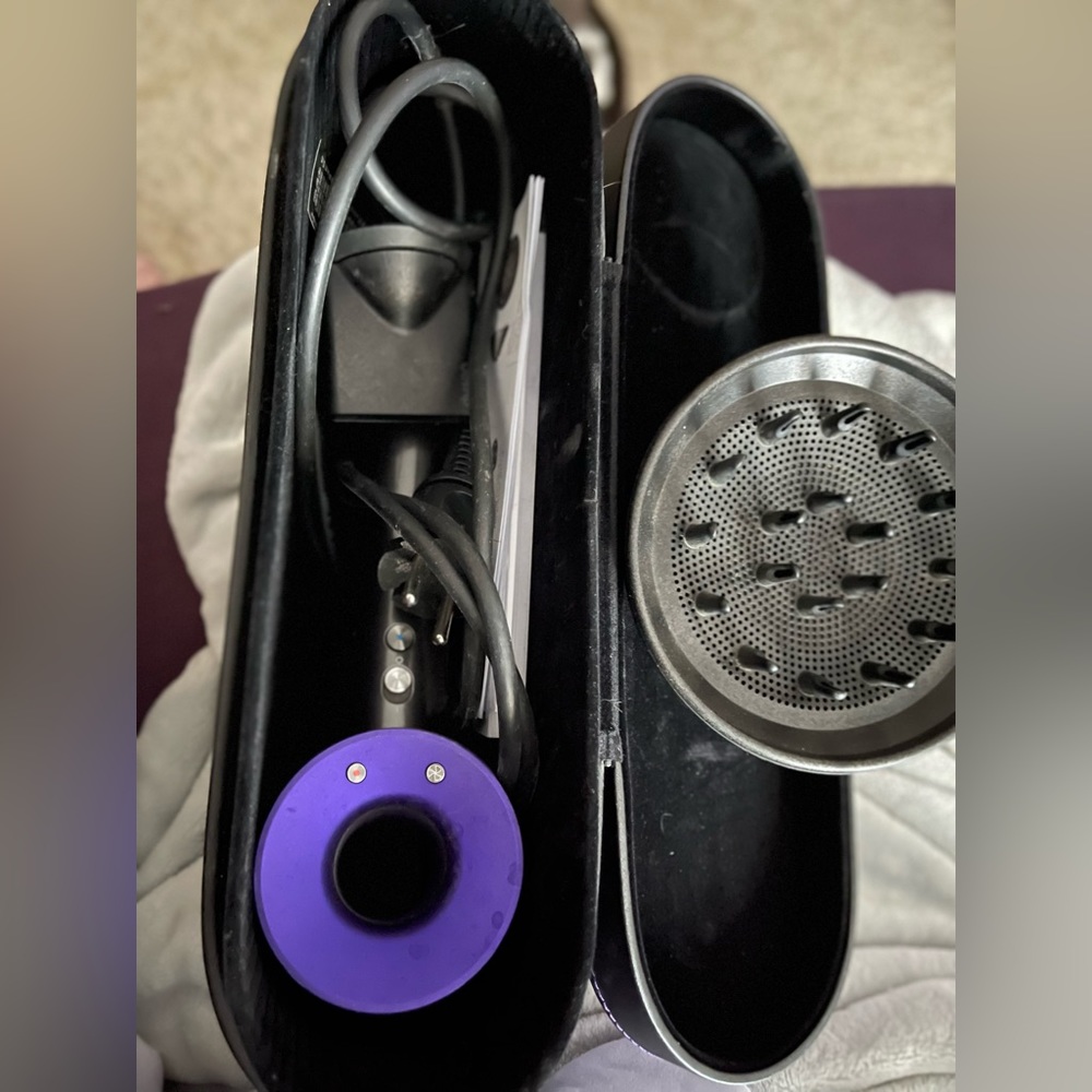 Dyson Supersonic hair dryer black/violet with black storage box.
